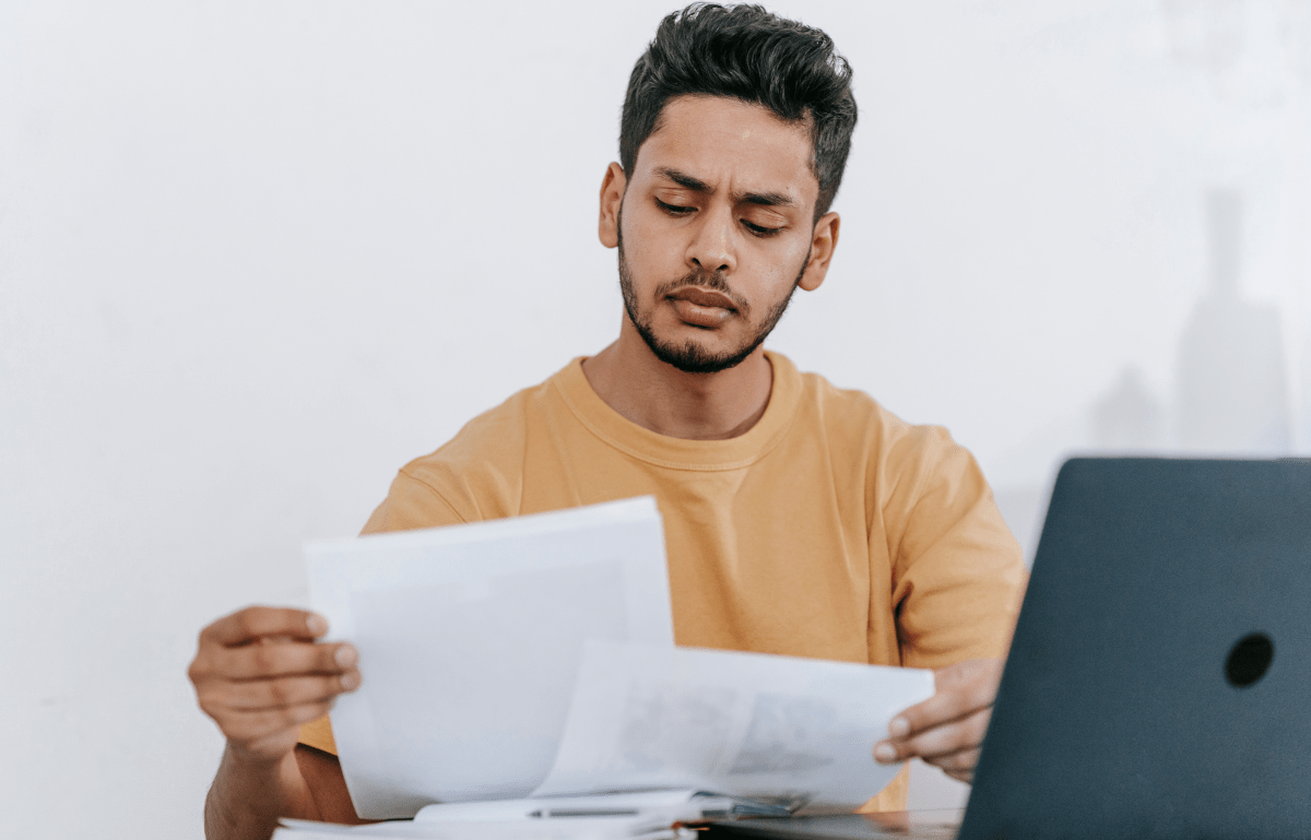 An entrepreneur reading through paperwork
